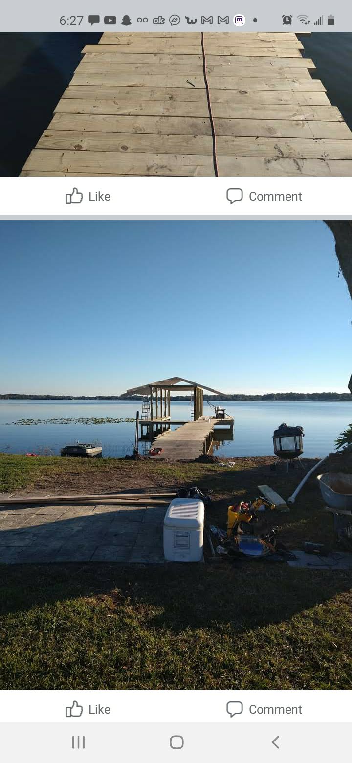 Finished dock and covered boat lift on open water