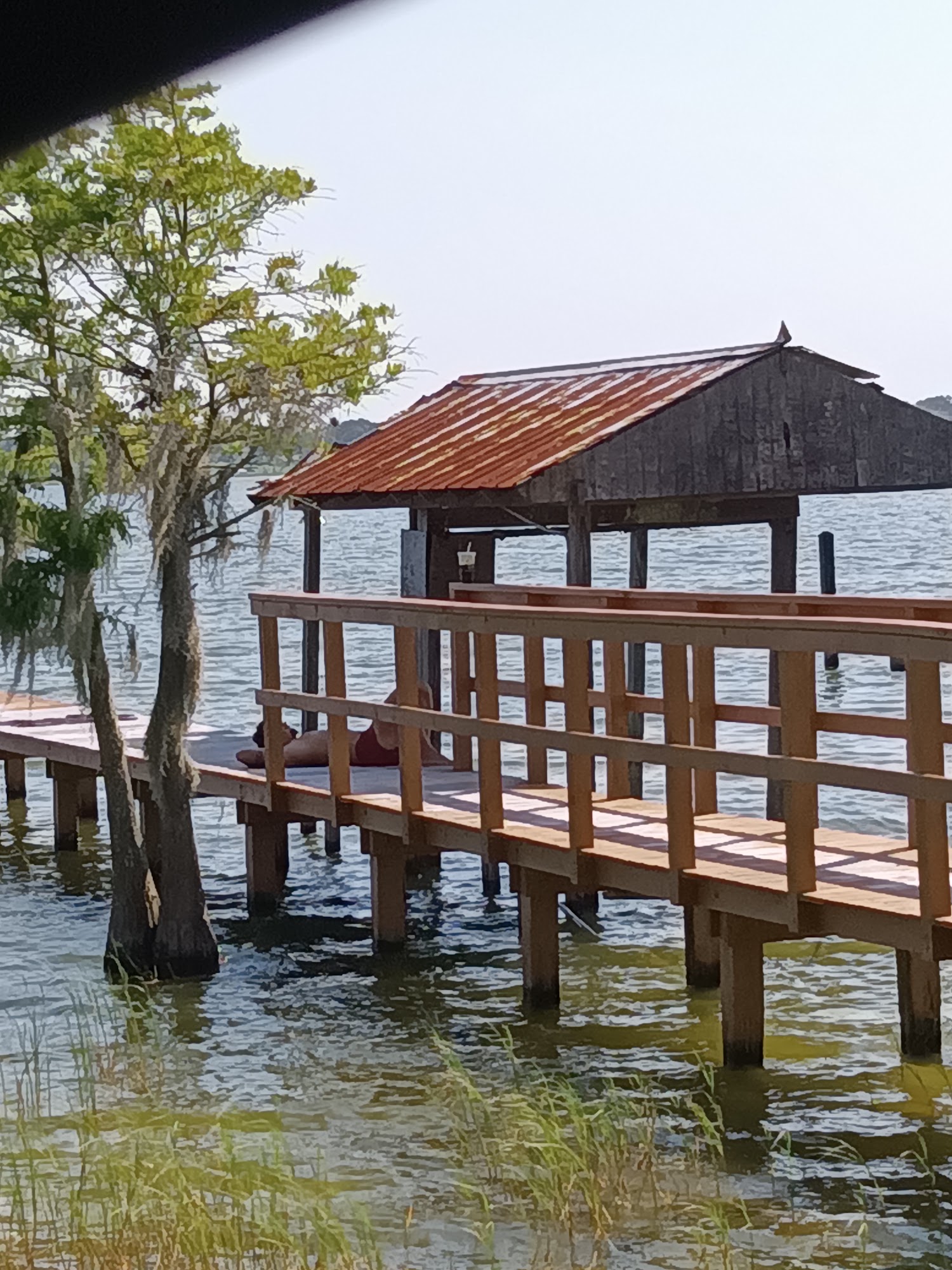 Large covered dock and wooden waterfront deck