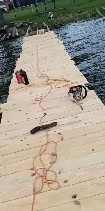 Workers installing fresh dock decking