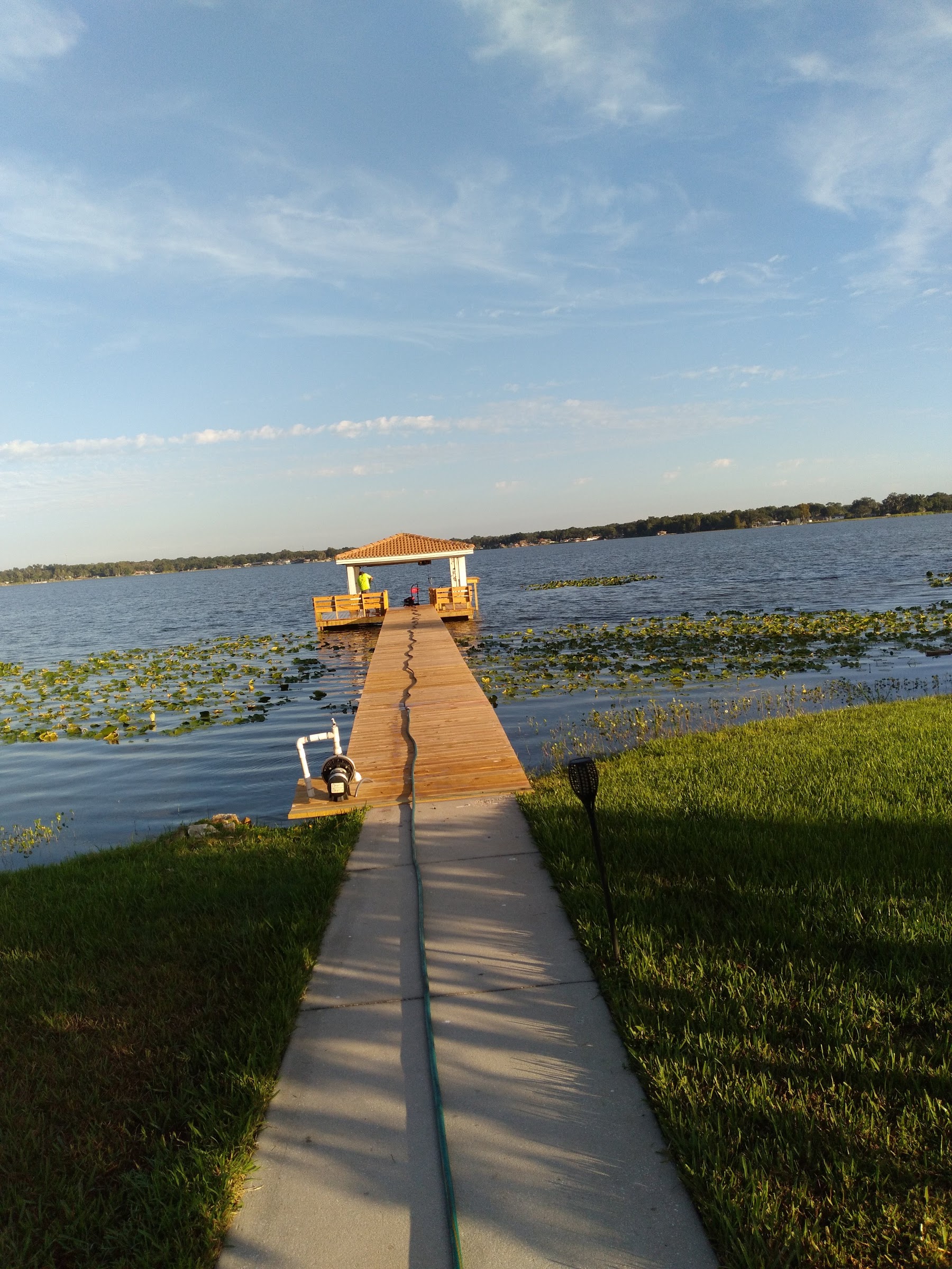 Long completed walkway to a covered dock