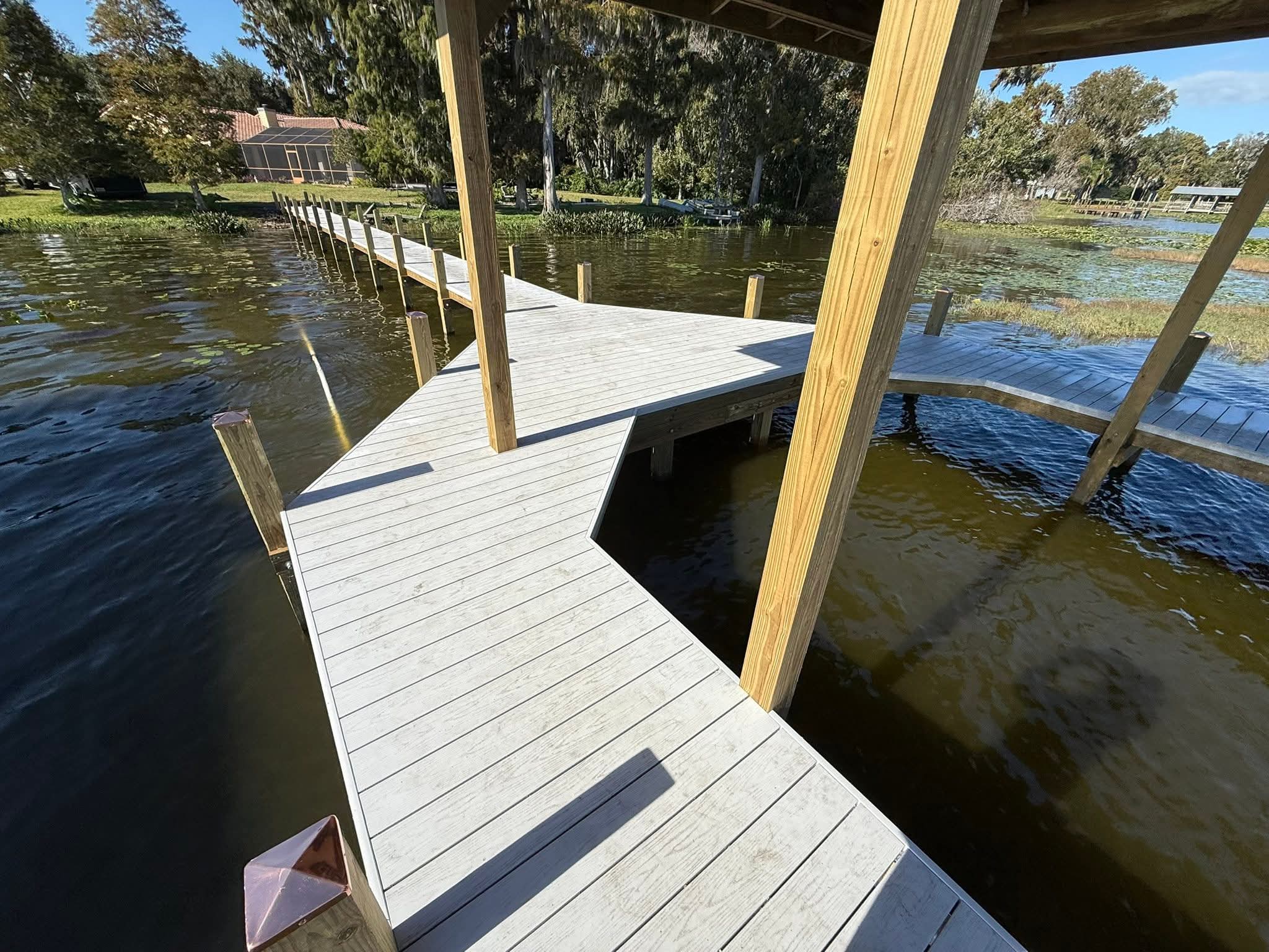 Clean finished composite dock with a covered platform